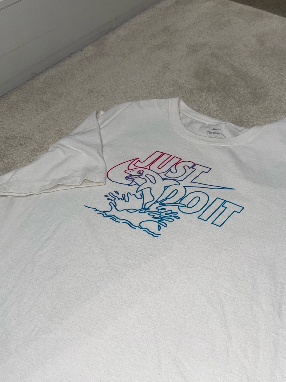 Nike Men’s White Short Sleeve Tee with Pink and Blue 'Just Do It' Dolphin Graphi